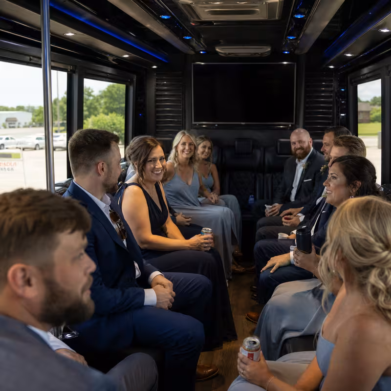 Wedding guests seated inside a Amarillo party bus