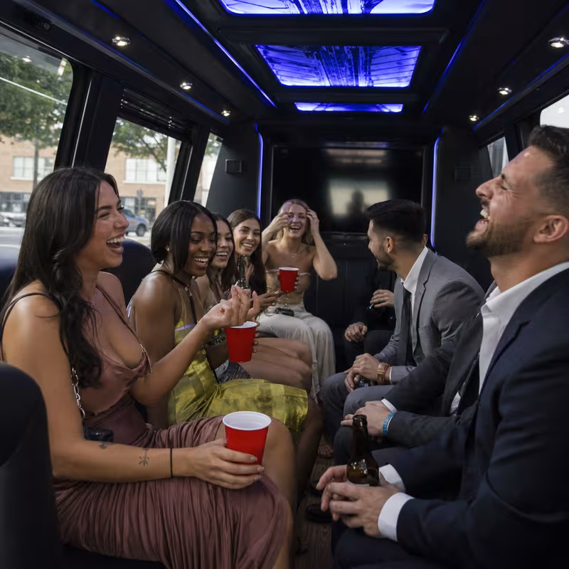 Party bus interior with wraparound leather seating and LED lighting in Amarillo