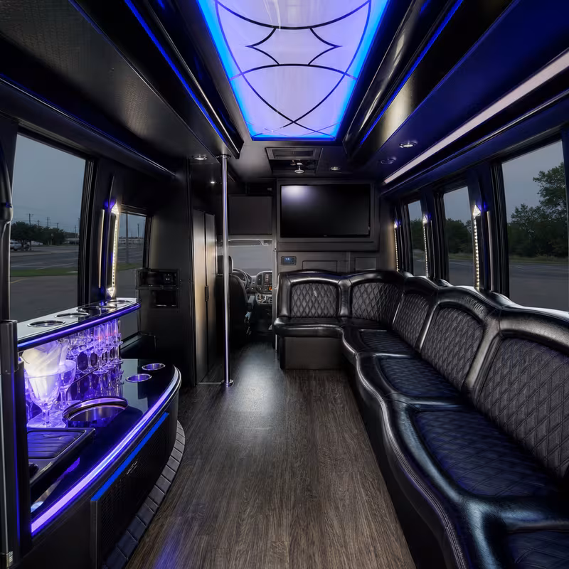 Party bus interior with wraparound leather seating and LED lighting in Amarillo