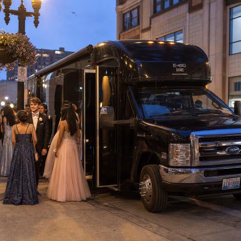 Passengers loading luggage while boarding an Amarillo group shuttle