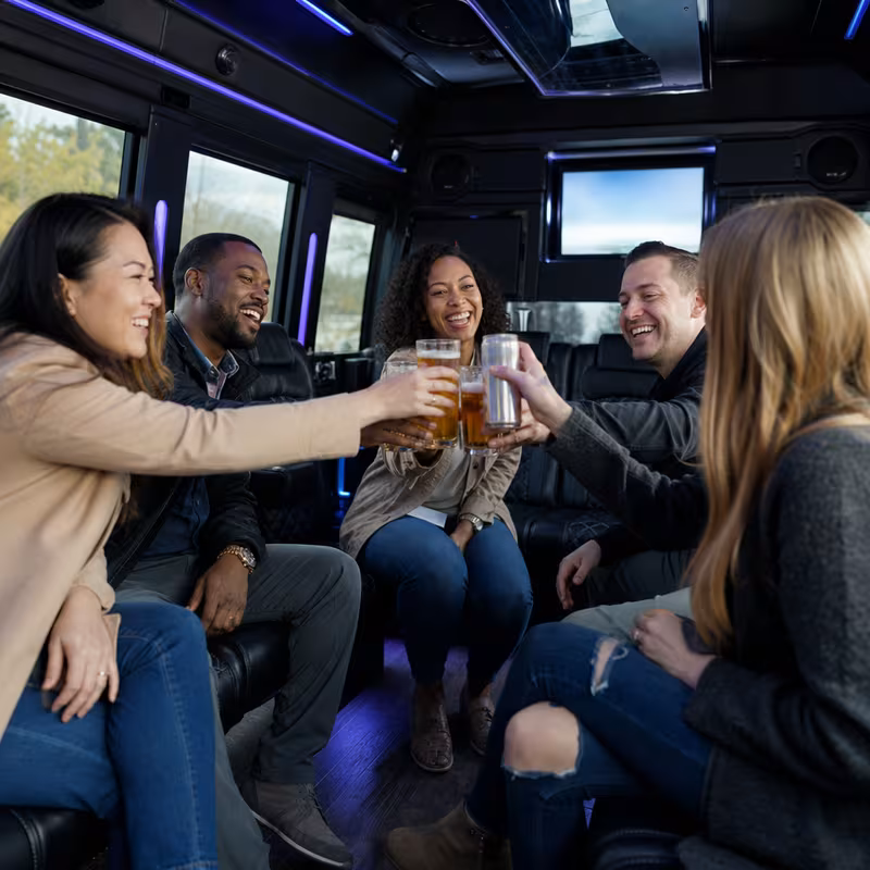 Group boarding a white charter bus for Winery & Brewery Tour Transportation transportation in Amarillo
