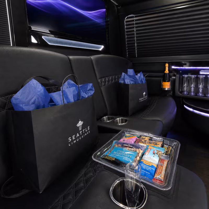 Party bus interior with wraparound leather seating and LED lighting in Amarillo